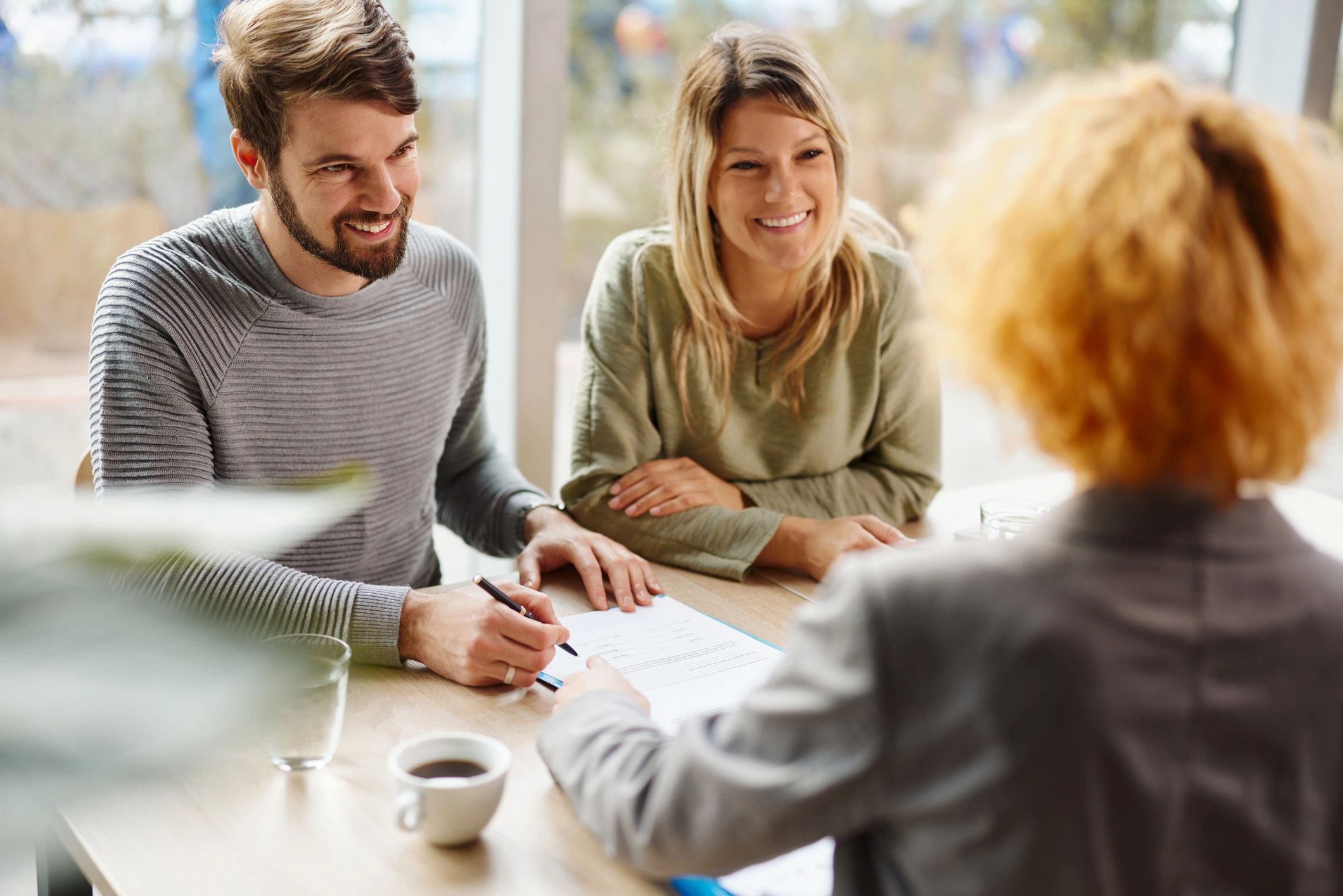Couple signing real estate documents